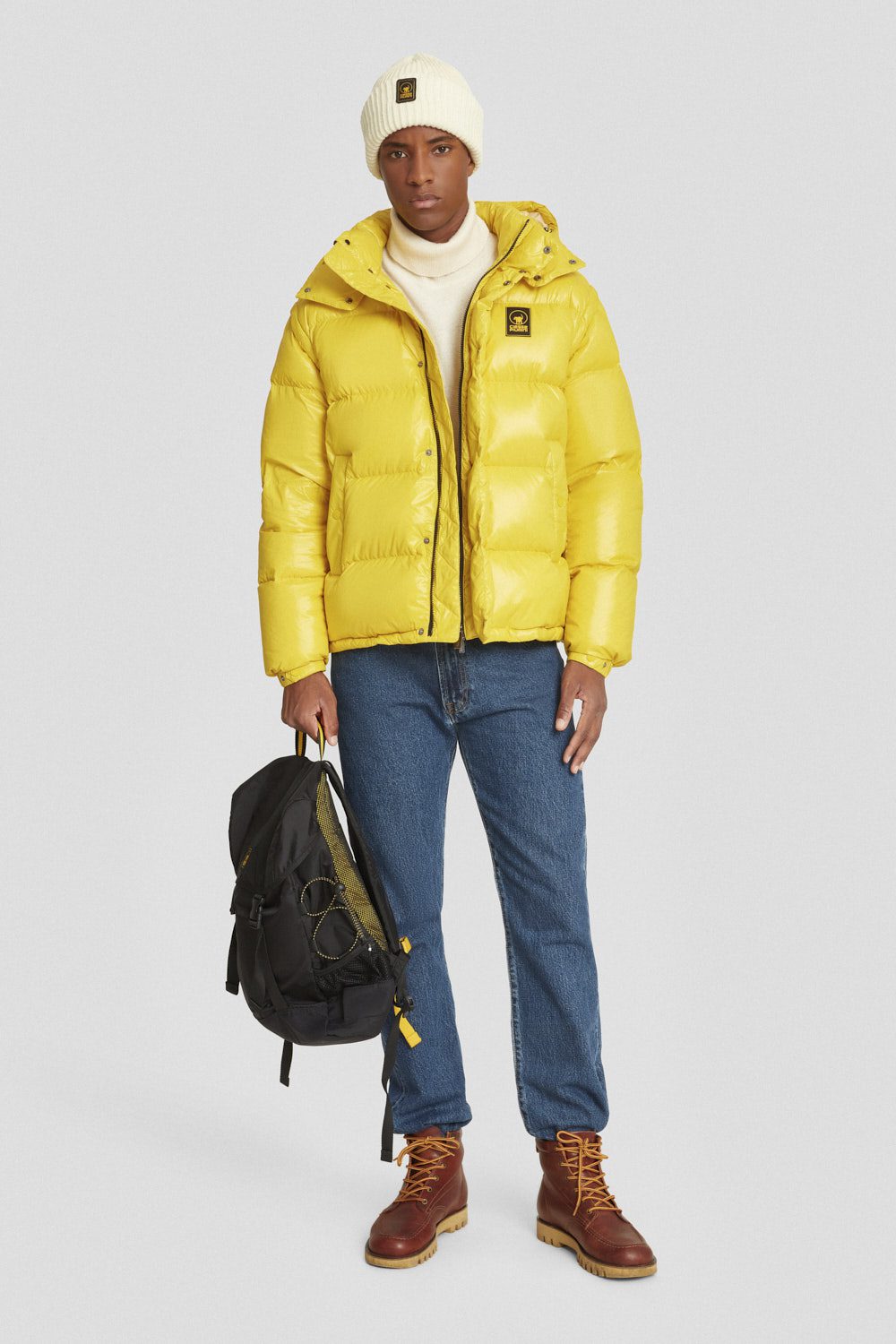 Piumino trapuntato giallo con cappuccio e maniche staccabili