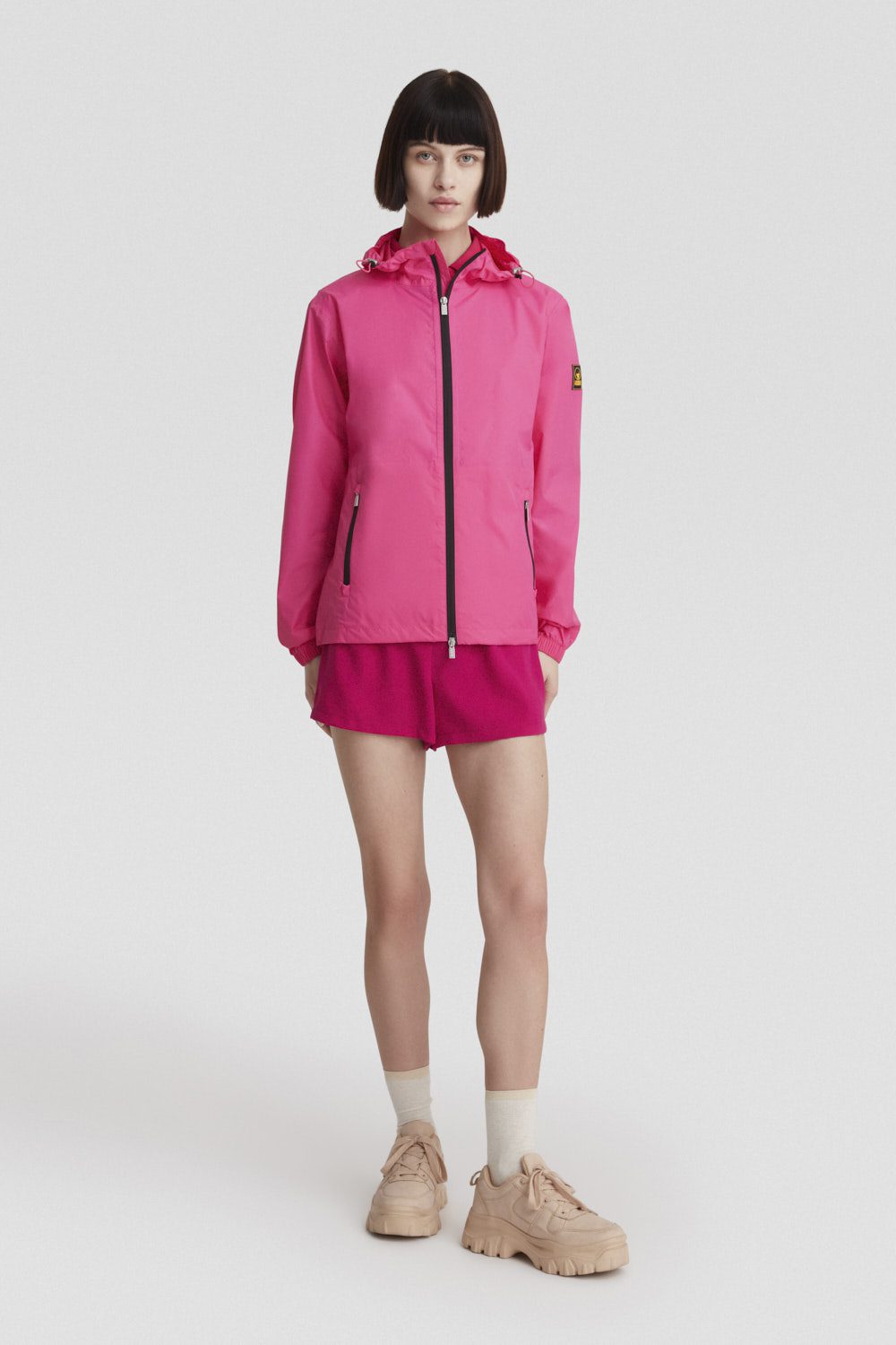 Giacca leggera antivento fucsia con cappuccio