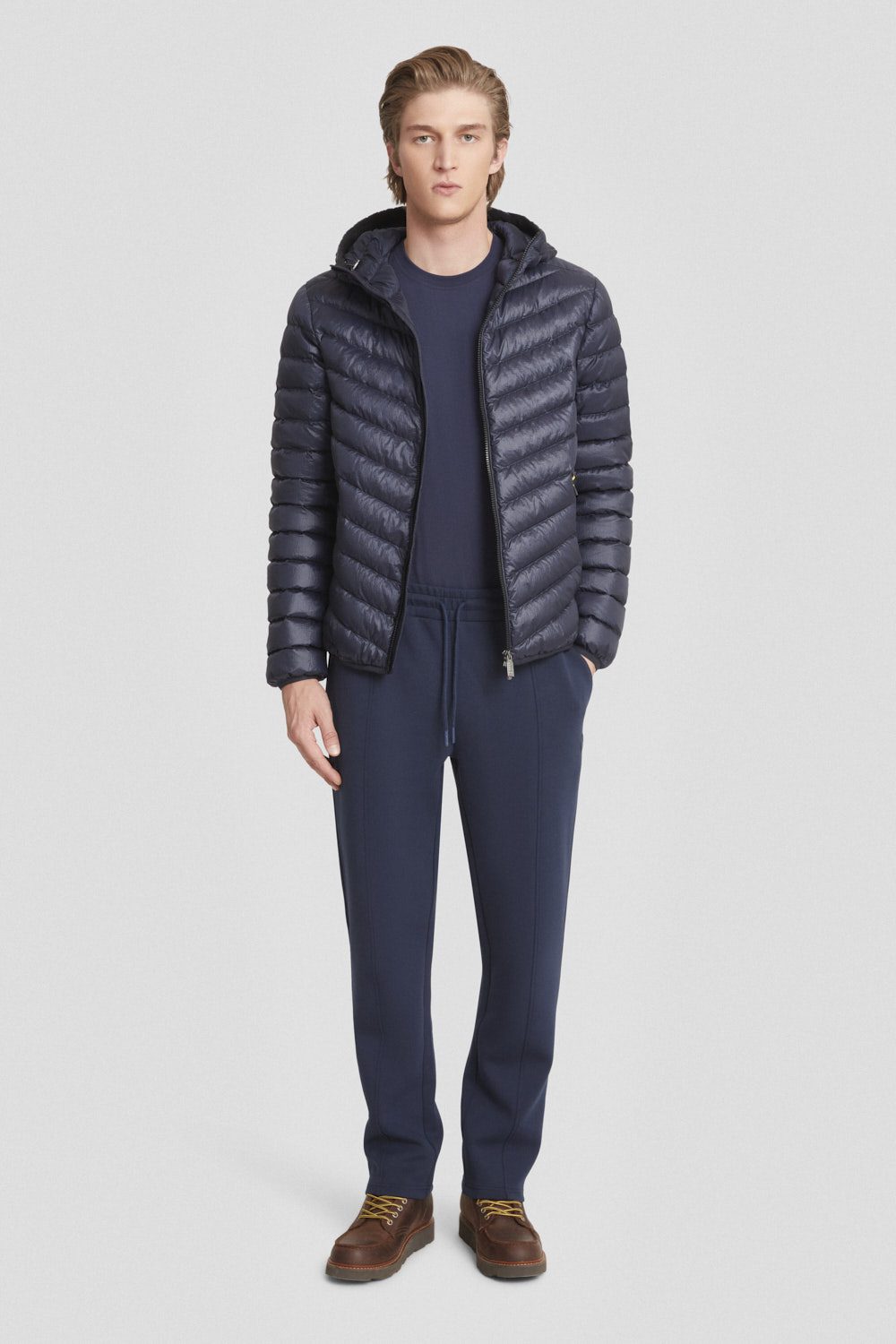 Piumino trapuntato blu con cappuccio