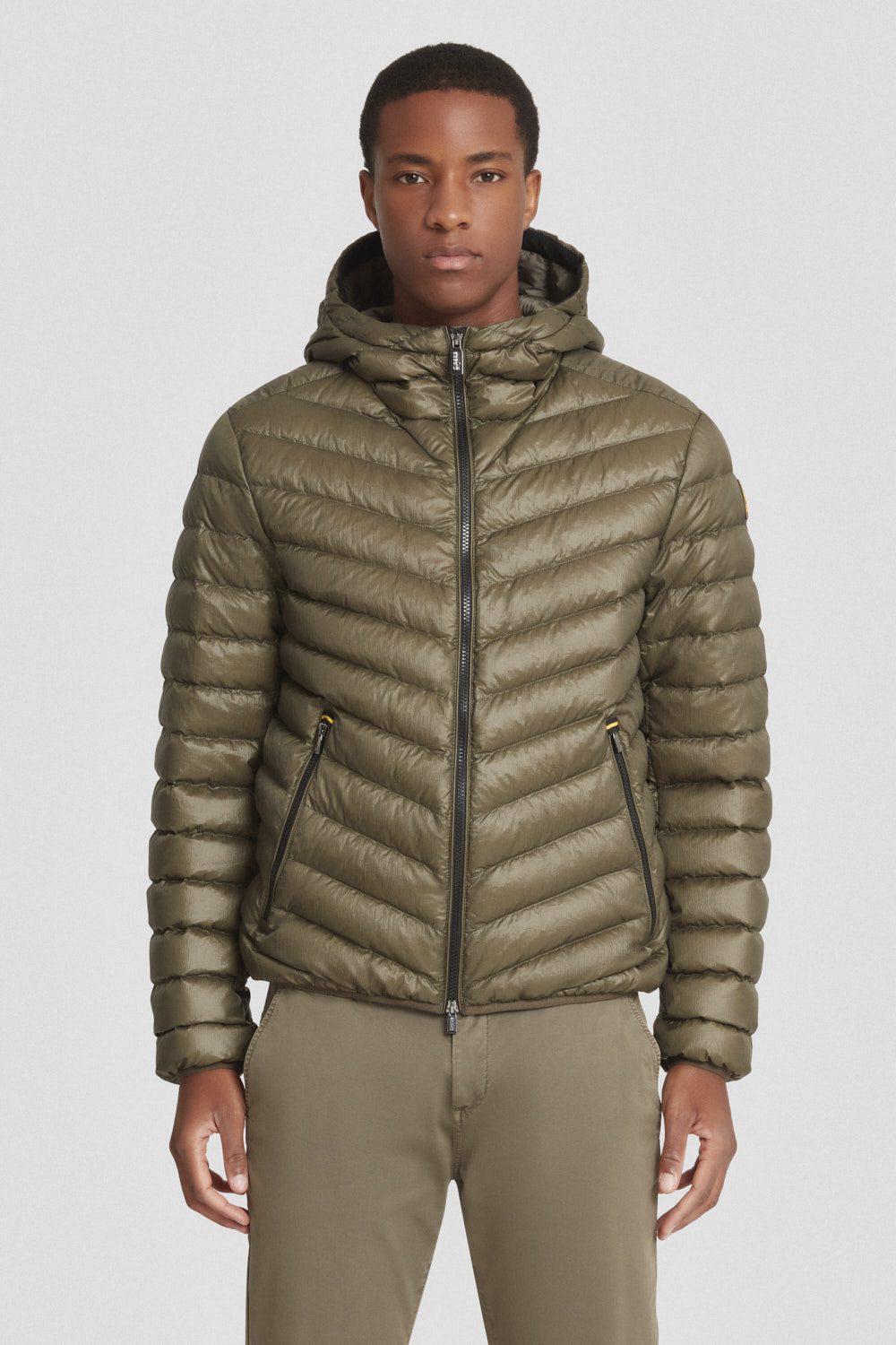 Piumino trapuntato verde militare con cappuccio