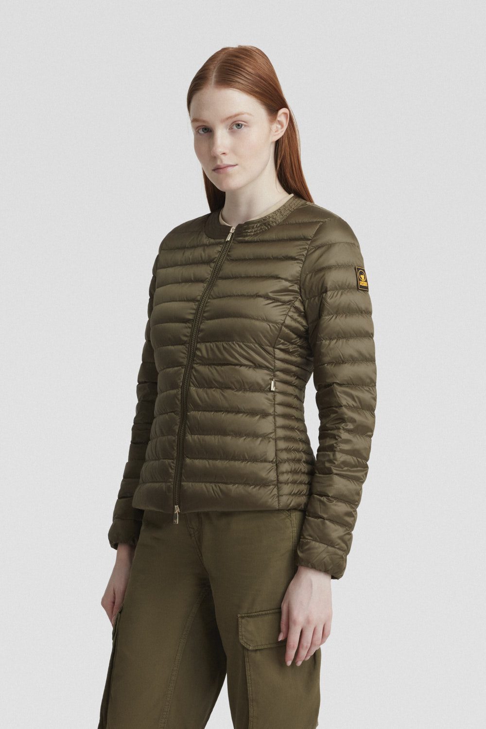 Piumino verde leggero in vera piuma