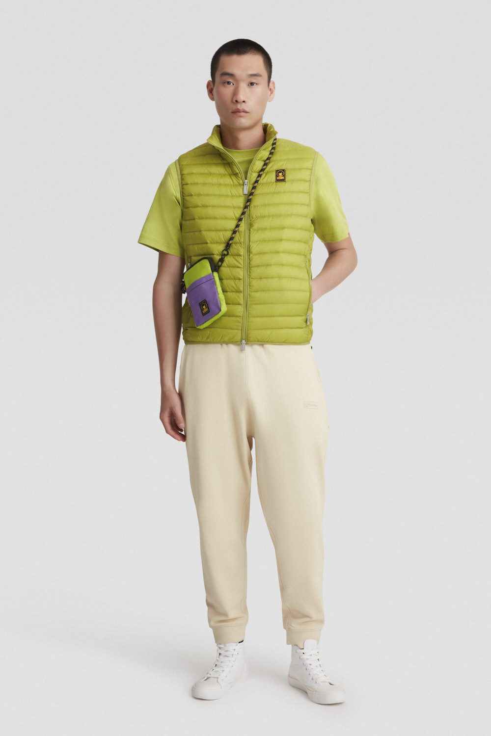 Piumino verde smanicato imbottito in vera piuma