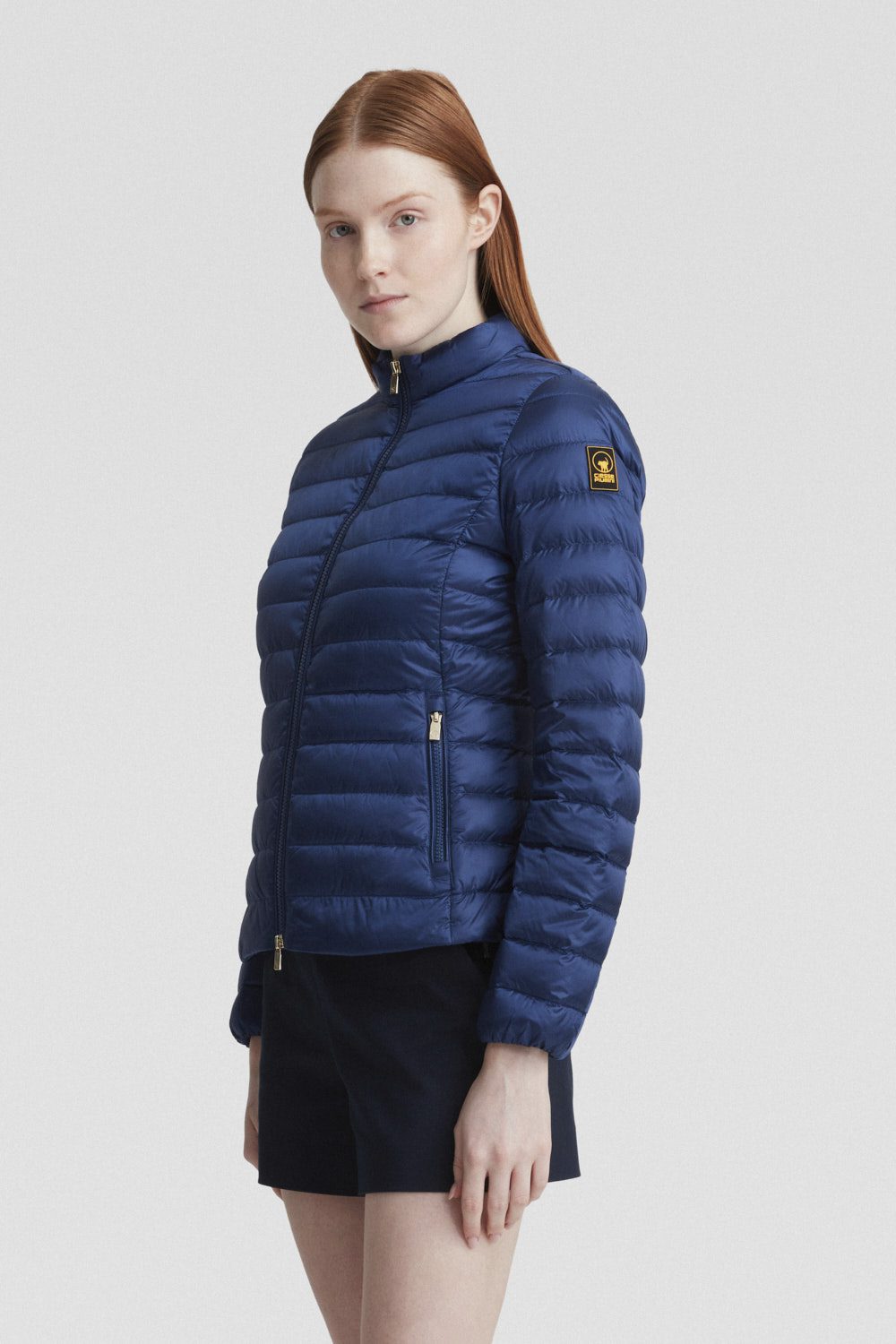 Piumino blu leggero in vera piuma