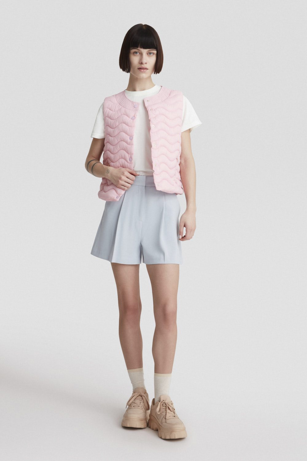 SAGITTA - Gilet rosa pastello con trapunta ad onde
